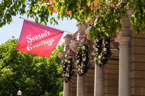 Seasons greetings flag at Town Hall
