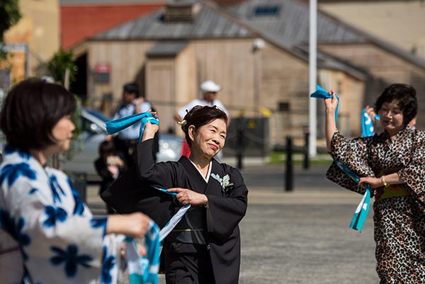 Japanese women dancing in traditional clothing