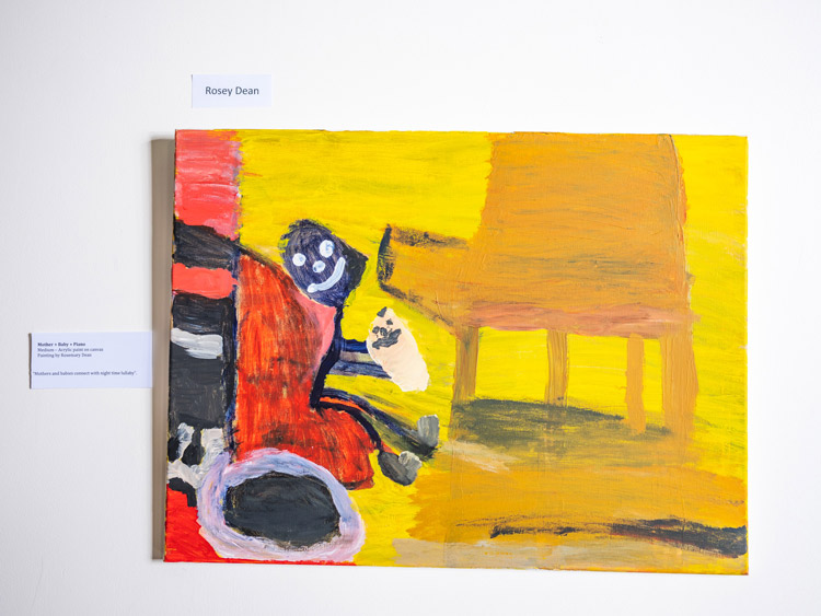Acrylic painting of a Mother holding her child in front of a piano Acrylic painting of a Mother holding her child in front of a piano