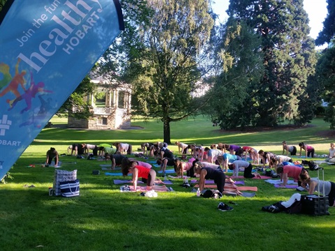Healthy Hobart yoga session in a park