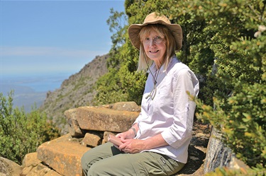 Mary Armsby taking in the views on the stone bench she helped install on the Zig Zag Track
