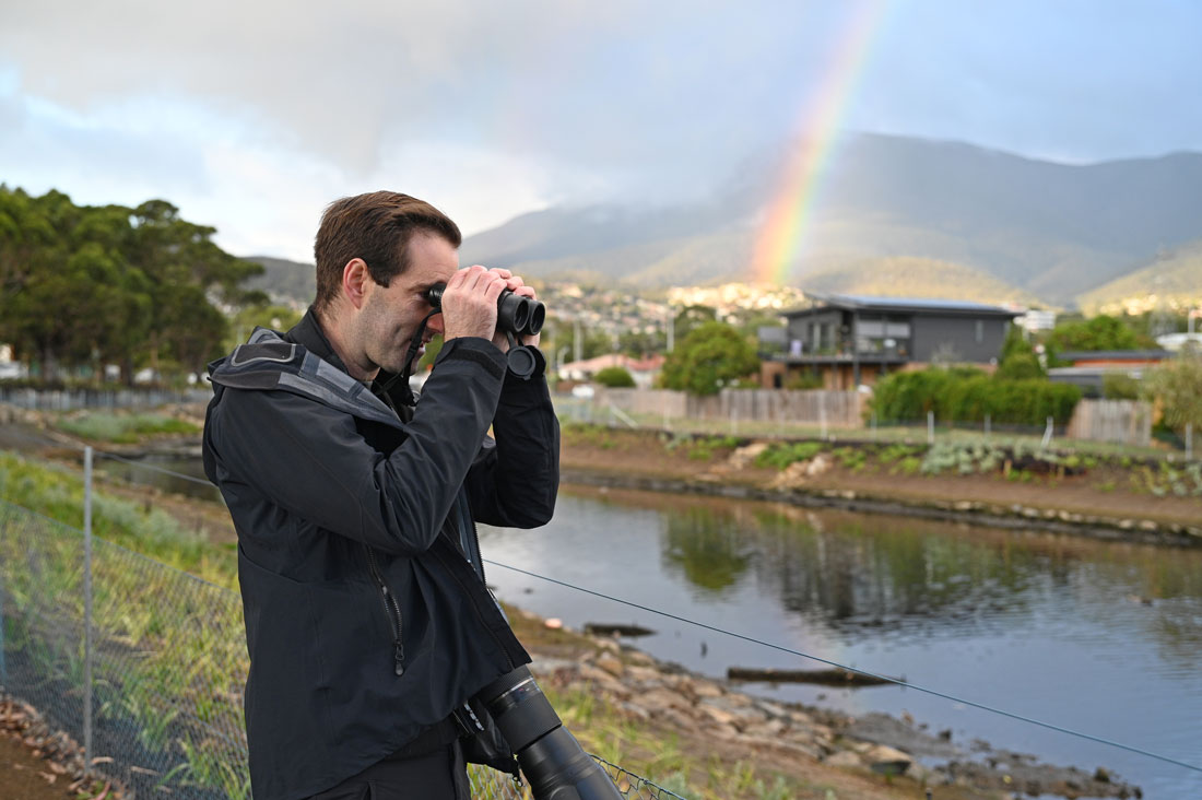Jason Graham bird watching on the New Town Rivulet.