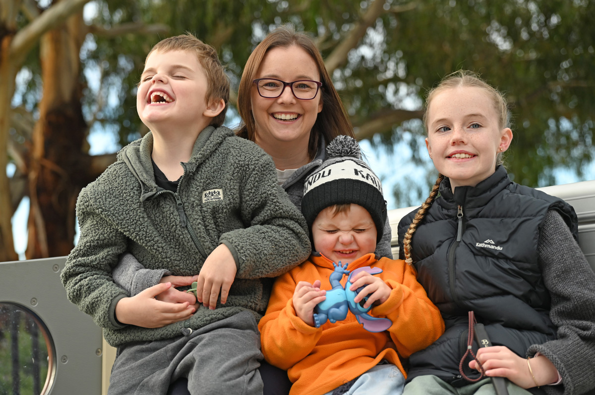 Lily with her mum and two brothers
