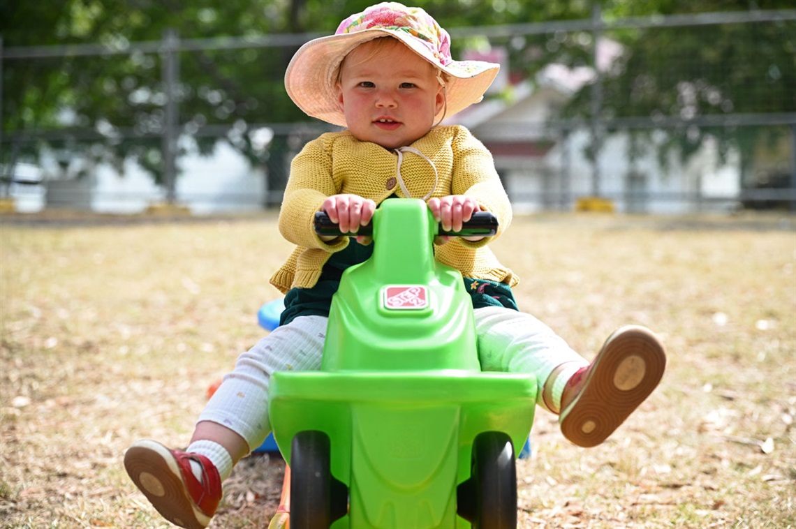 Young child tests out ride-on toy