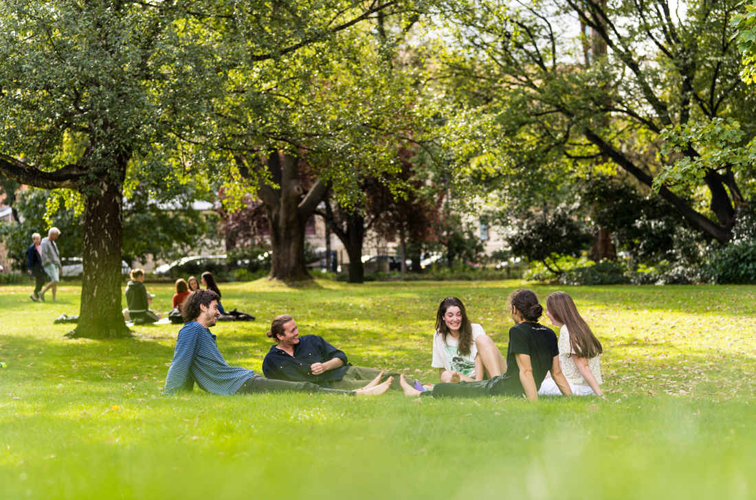 People picnicking on the grass in St David's Park.