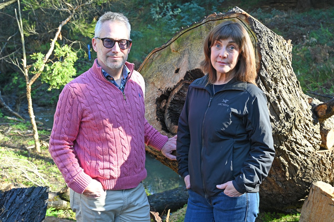 Mike and Julia in front of fallen crack willow tree.