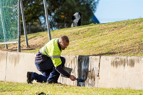 Graffiti being removed
