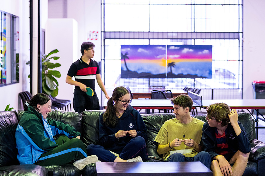 People sitting on a couch at the Youth Arts and Recreation Centre